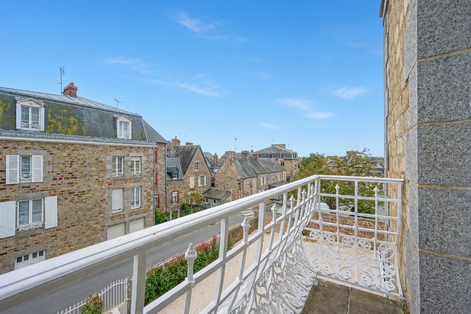 View from the wrought-iron balcony of Le Manoir Ducey over the Normandy village
