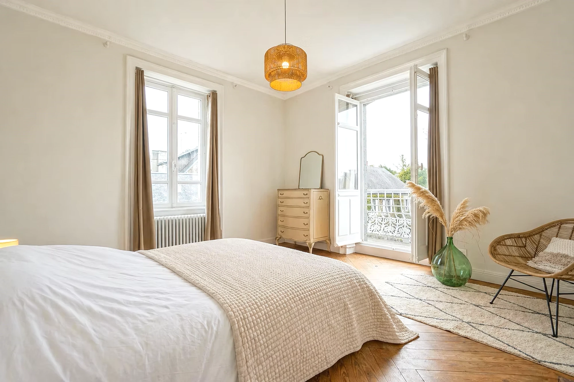 Bedroom at Le Manoir Ducey with a balcony overlooking the garden